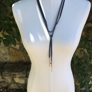 Anthro, blue suede wrap necklace gold end detail.